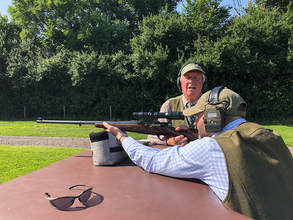 A guest, under expert instruction, tries a .375 H&H Magnum at the new rifle range. 