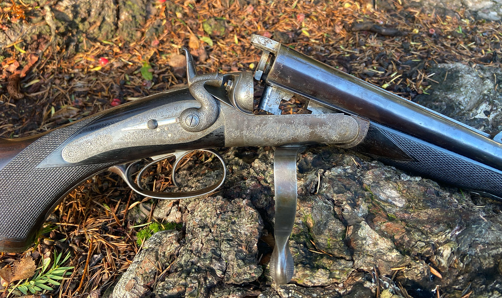 double rifle with vertical bolt and Jones screw-grip action