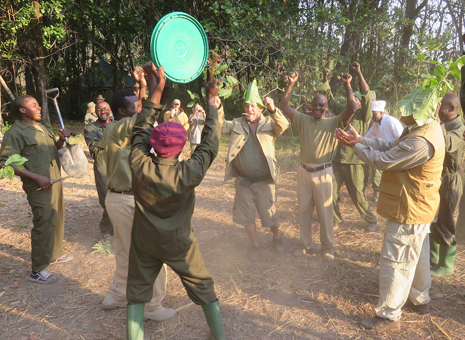 Staff and hunters celebrate a successful lion hunt in Tanzania.