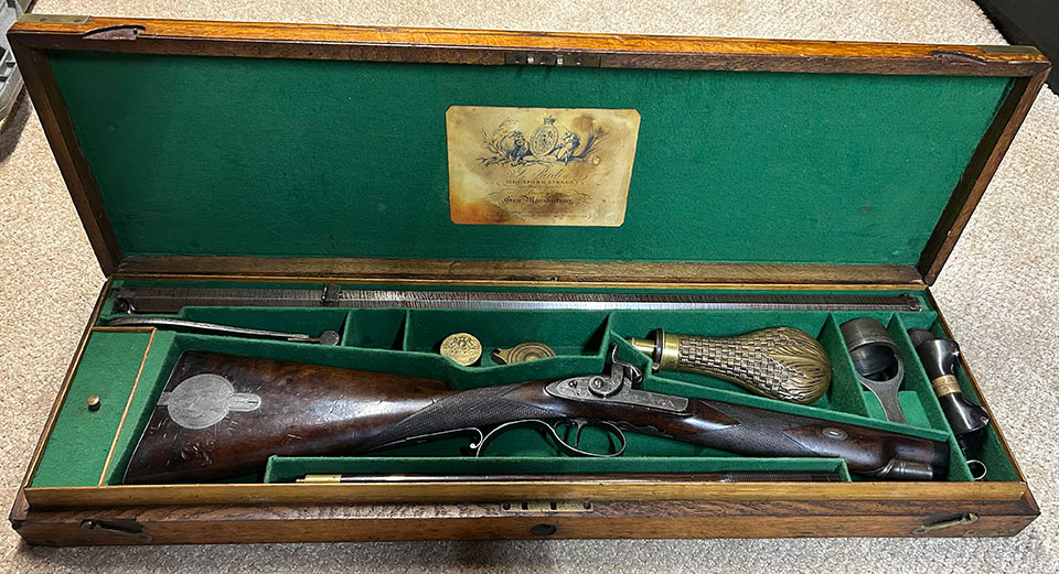 Purdey 2765 in its oak case with various accessories. The original mahogany case included an extra 36&rdquo; barrel.