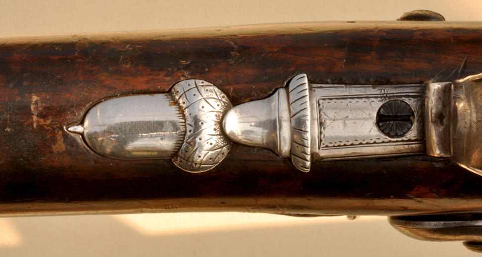 The acorn was the typical form of the filial on the trigger-guard at the date of this gun.