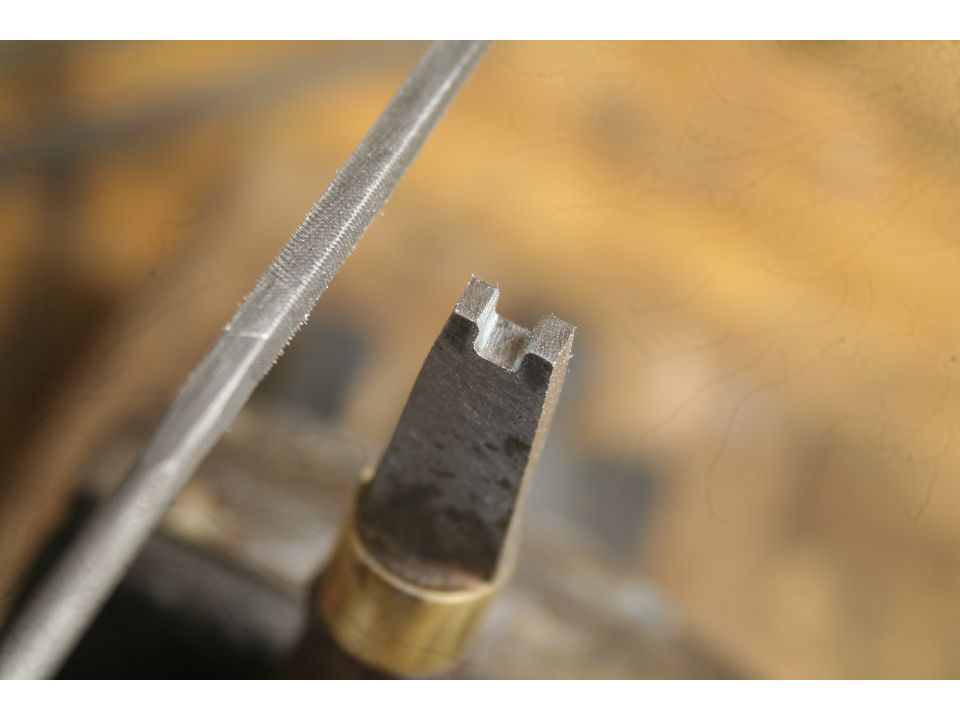 Turnscrew cut to a 'V'.