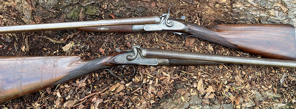 Two Thomas patent 12-bores, by different makers.