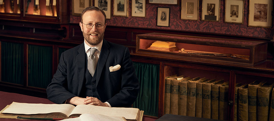 Dr. Nicholas Harlow at work in the Long Room.