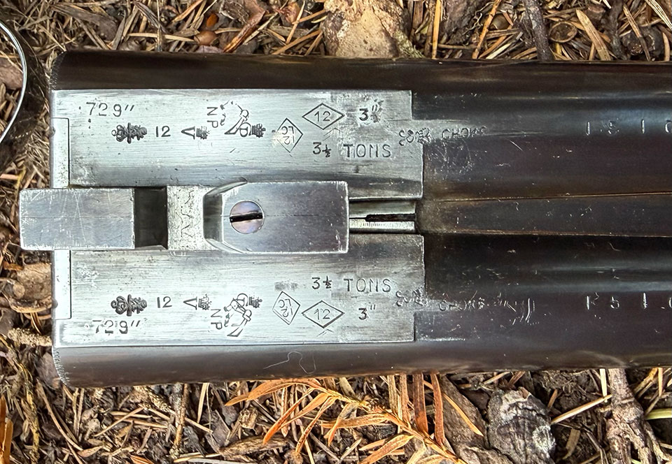 The proof marks show that the gun has been re-proof tested in London and stamped with the pressure and the chamber length under the 1925 Rules of Proof. Note the original mark 'LC' meaning 'long chamber' confirms that it was made this way.