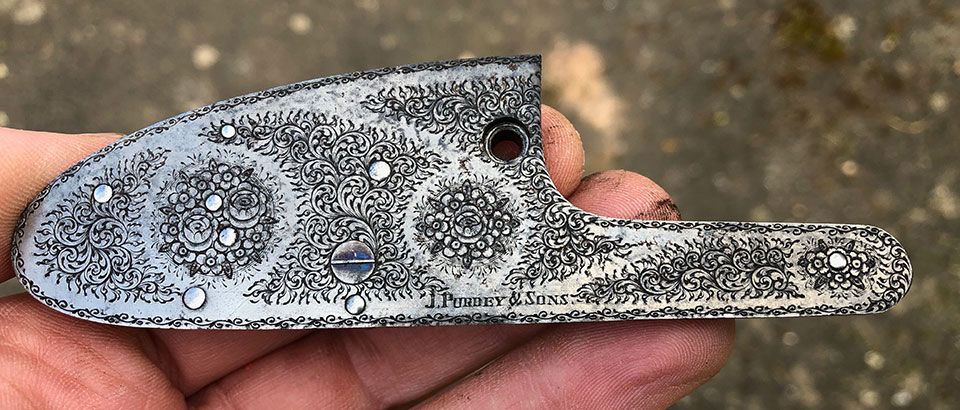 Purdey rose & scroll engraving adorns the lock plates.