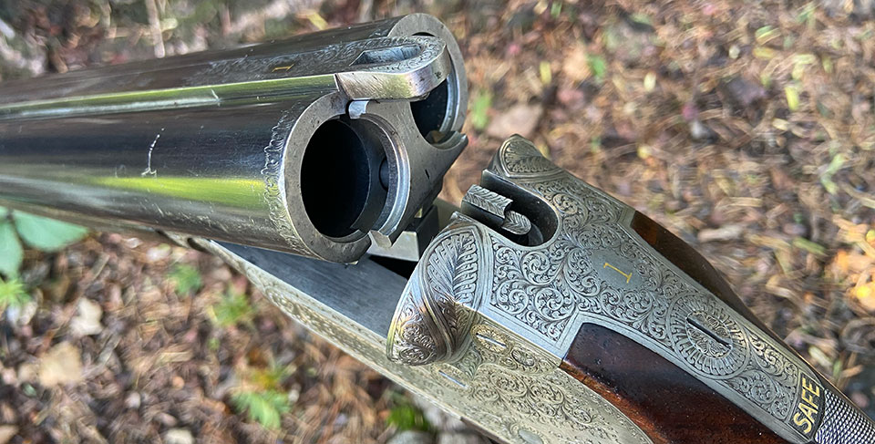 A 12-bore Rigby shotgun with snap under-lever and rising-bite ation.