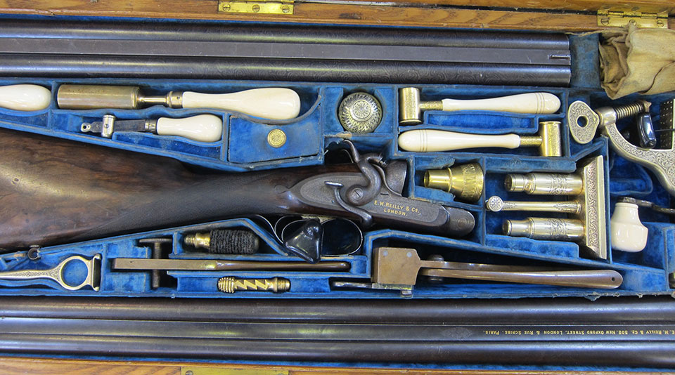 E.M. Reilly 12-bore with both fully rifled barrels and smooth-bore barrels, making a rifle/shotgun option on the same action.