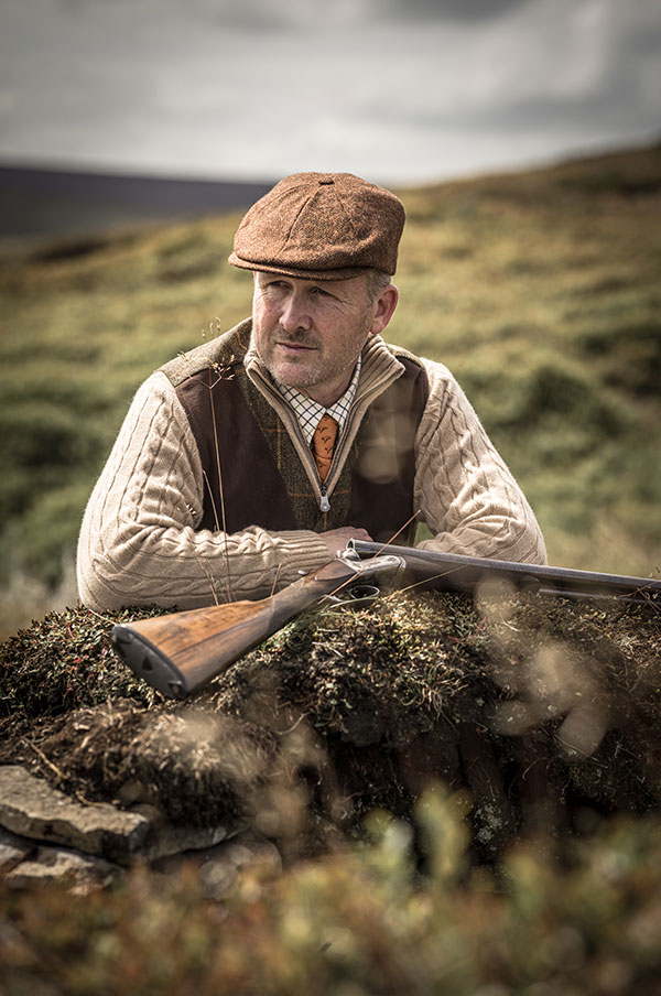 Diggory Hadoke, Vintage Guns Journal Editor sitting at his desk working hard