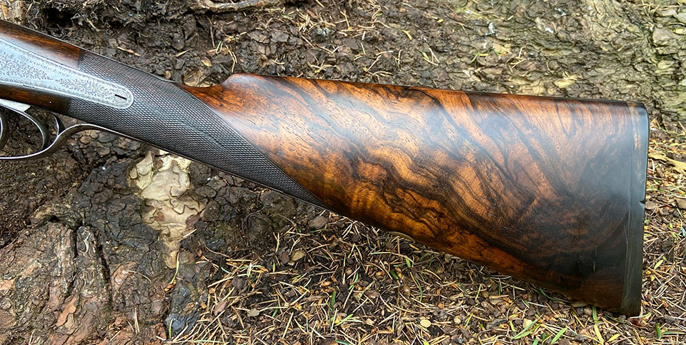 The stock is well figured, with a horn butt-plate.