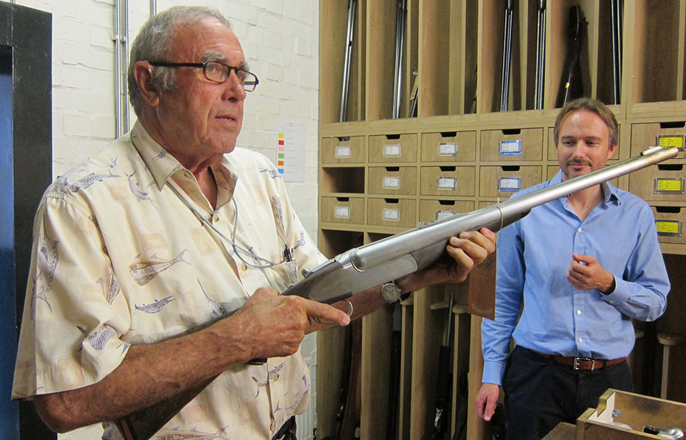 M.D 'Trigger' looks on while Cecil Mills checks a new-build sidelock double rifle.