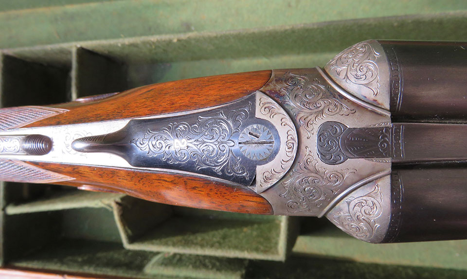 The top-lever with bolted doll's head persisted at Westley Richards into the hammerless era.