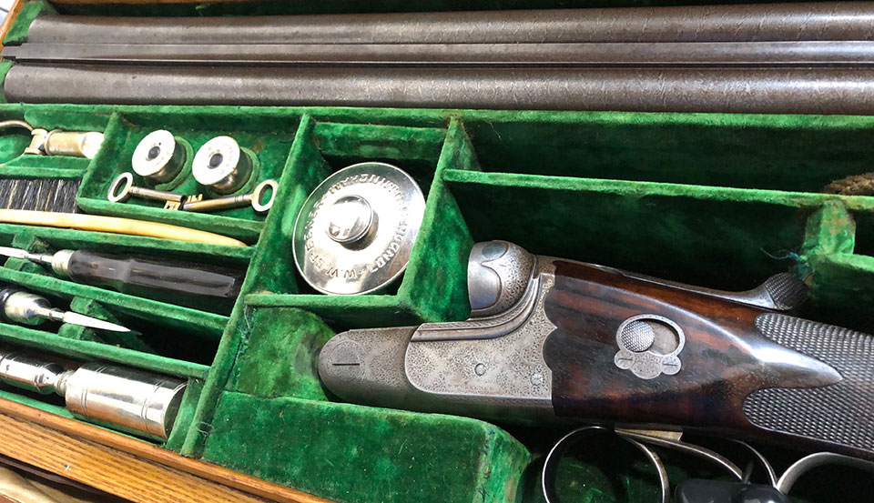 A beautifully cased gun with full set of accessories excites many collectors.