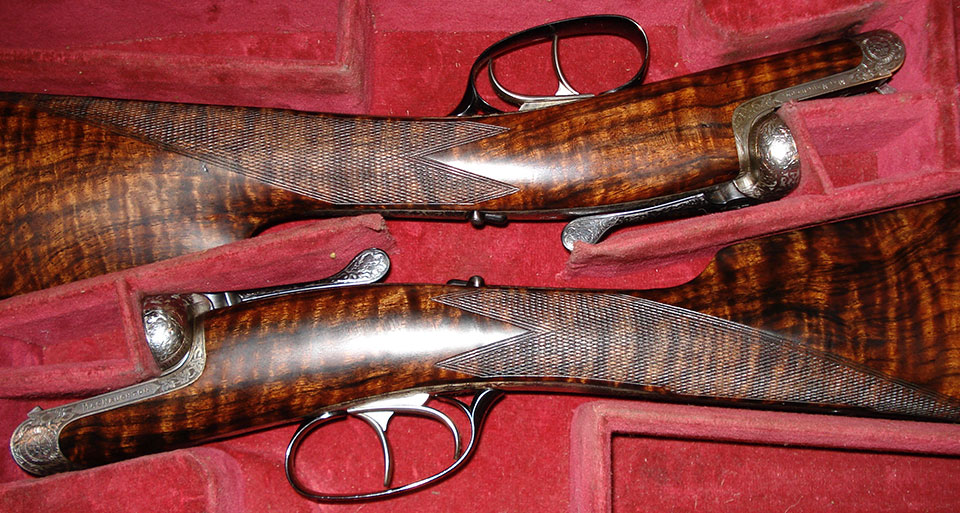 A pair of MacNaughton 'skeleton action' guns.