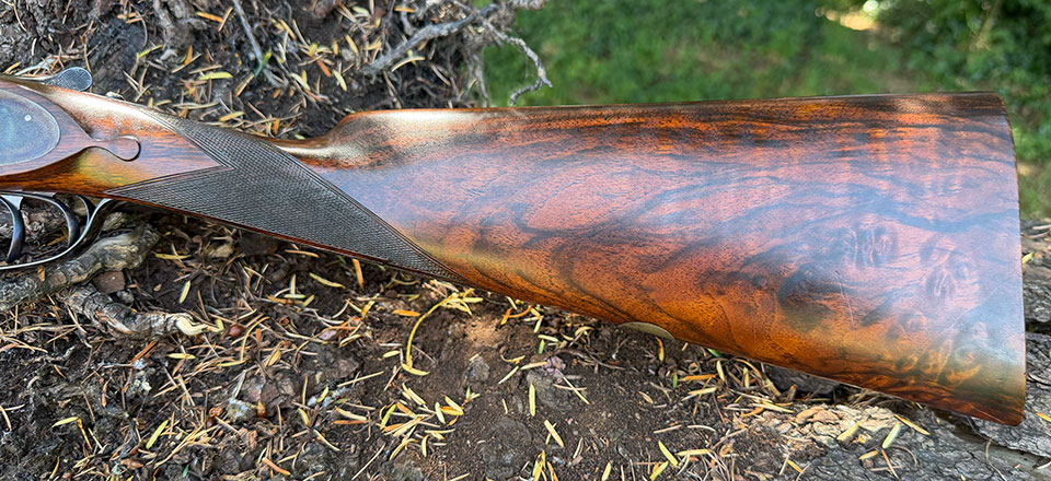 Almost 15" of classic dark walnut, with Purdey's straight hand and drop-points.